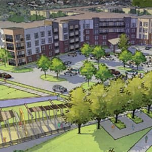 Aerial view of a modern urban complex with multi-story buildings, landscaped areas, and a parking lot.