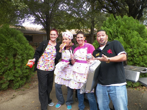 A cheerful group of friends dressed in funny costumes, enjoying a day outdoors.