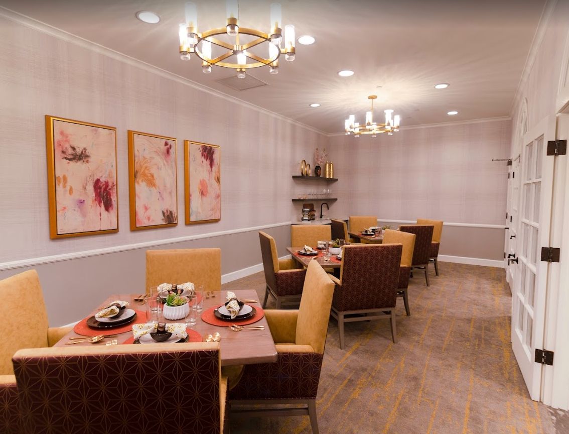 Elegant dining room with stylish furniture and warm lighting.