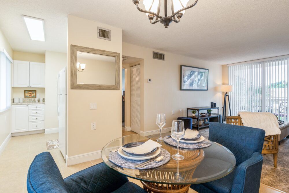 A cozy dining area with a modern table setting in an elegantly decorated apartment.