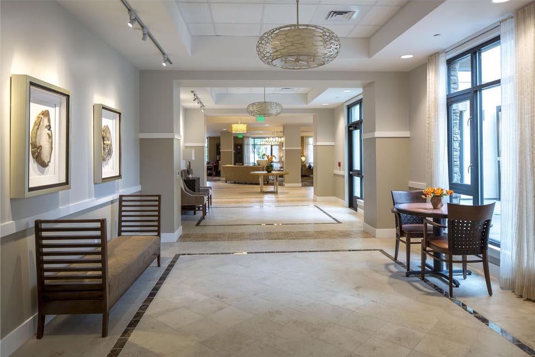 A modern lobby with seating and elegant decor.