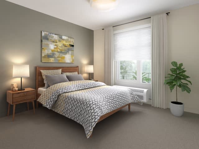A modern bedroom with stylish decor and a large window.