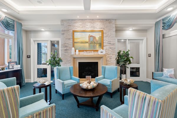 A modern living room with a fireplace and comfortable seating.