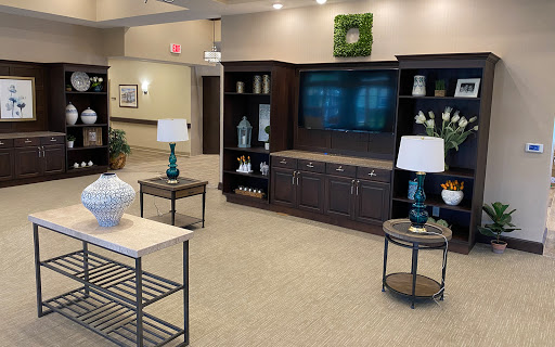 A welcoming lobby area featuring modern furniture and decorative elements.