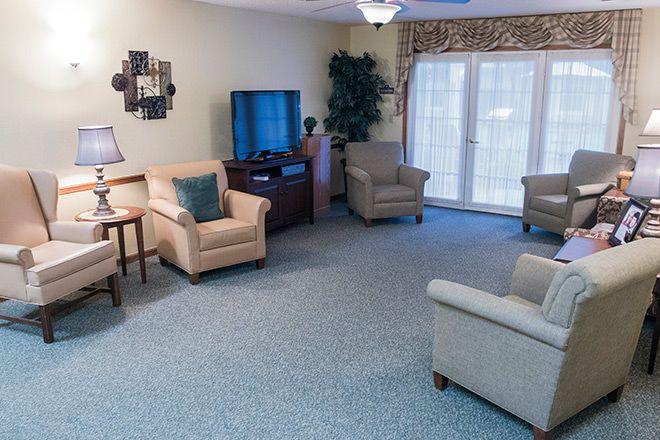 A cozy living room with comfortable seating and a television.