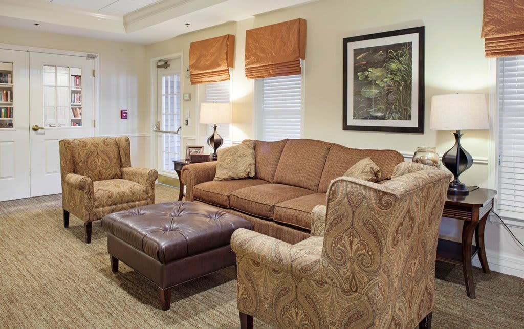 A cozy living room with comfortable seating and warm lighting.