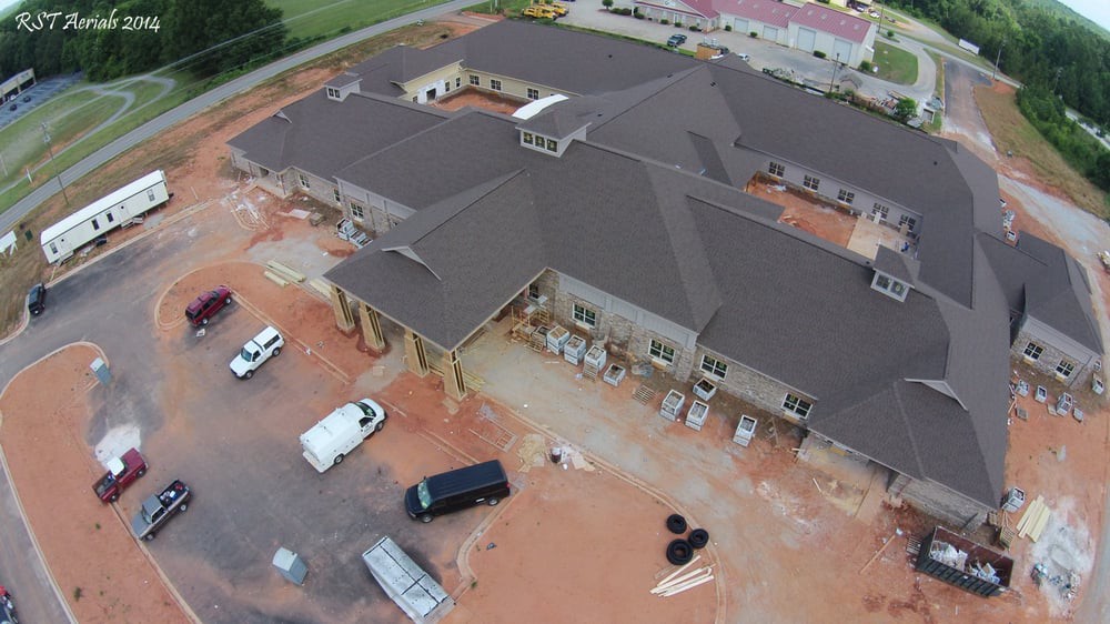 Aerial view of a construction site with multiple vehicles present.