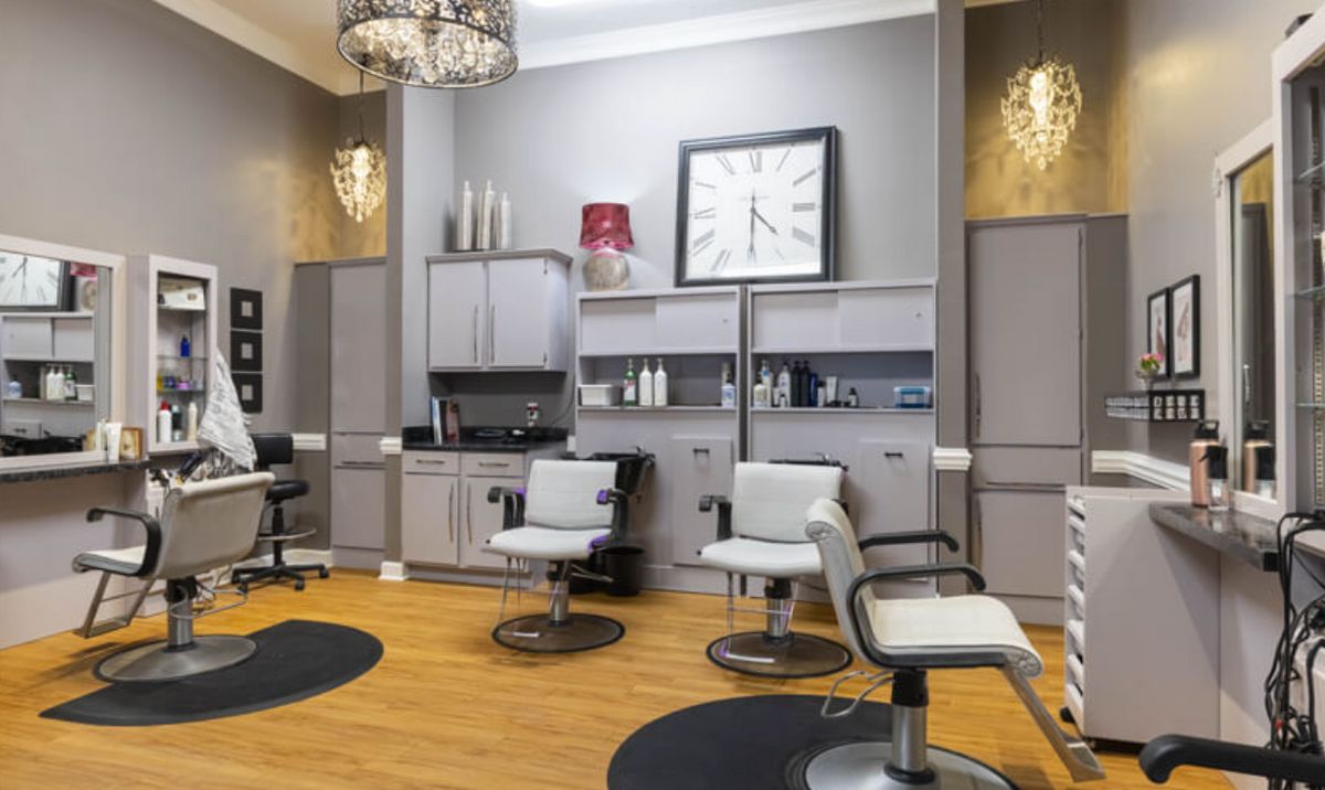 Modern hair salon interior with chairs and stylish decor.