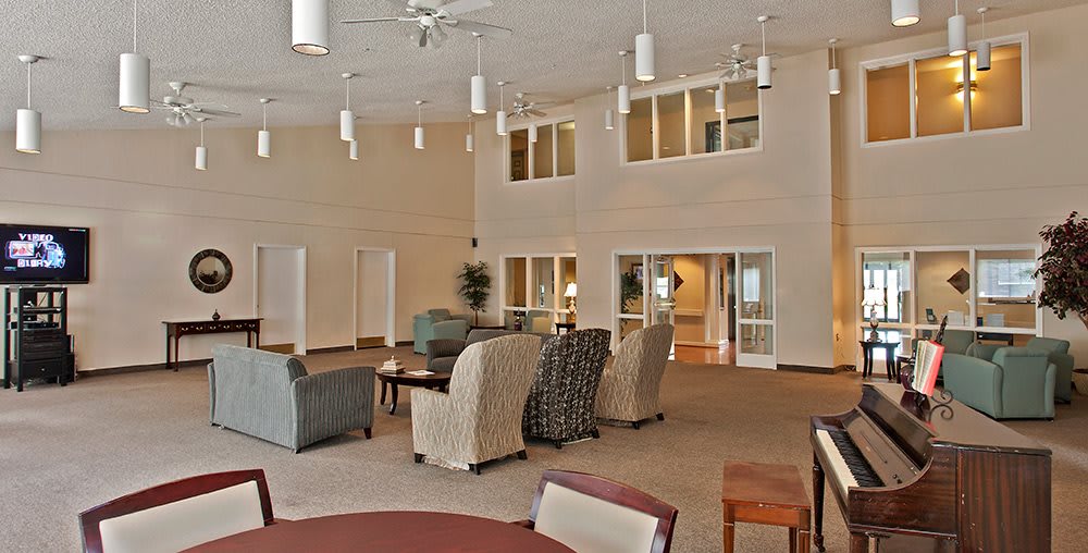 A spacious and modern lounge area featuring comfortable seating arrangements.