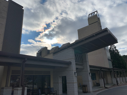 A modern building under a cloudy sky.