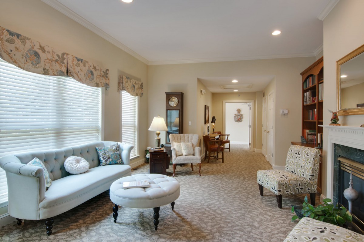 A cozy living room with comfortable seating and warm lighting.