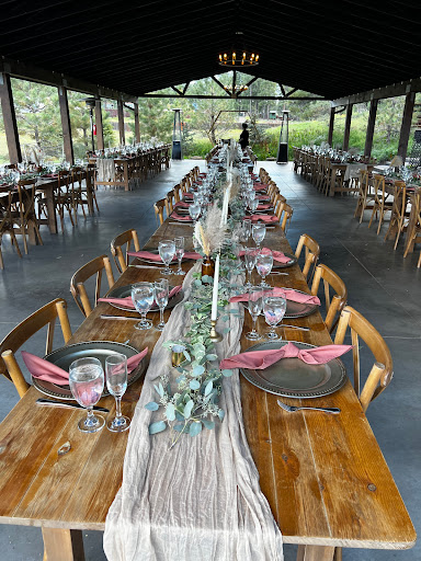 A beautifully arranged outdoor dining setup, perfect for a special event amidst nature.