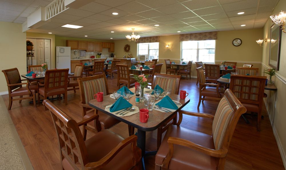 A well-arranged dining area with neatly set tables and comfortable seating.