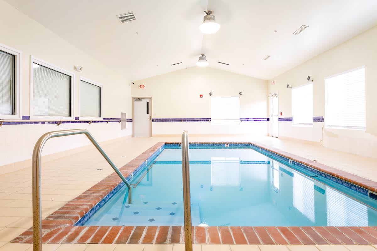 A bright indoor swimming pool facility with a calm and inviting atmosphere.