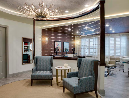 A stylish and inviting reception area featuring modern furniture and elegant lighting.