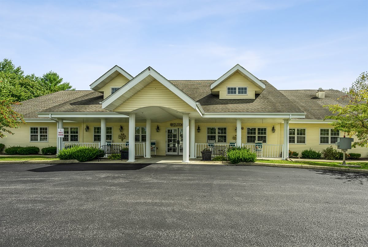 A suburban residential building with an inviting entrance and a driveway.
