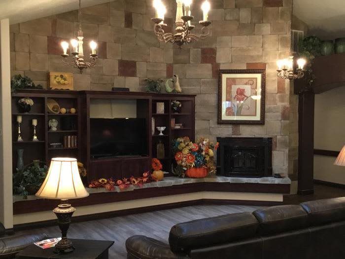 A cozy living room with a fireplace and elegant decor.