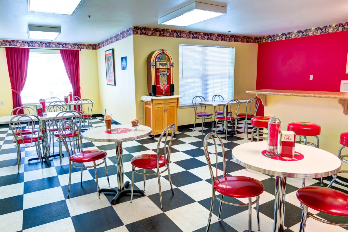 A retro-style diner with checkered floors and a classic jukebox.