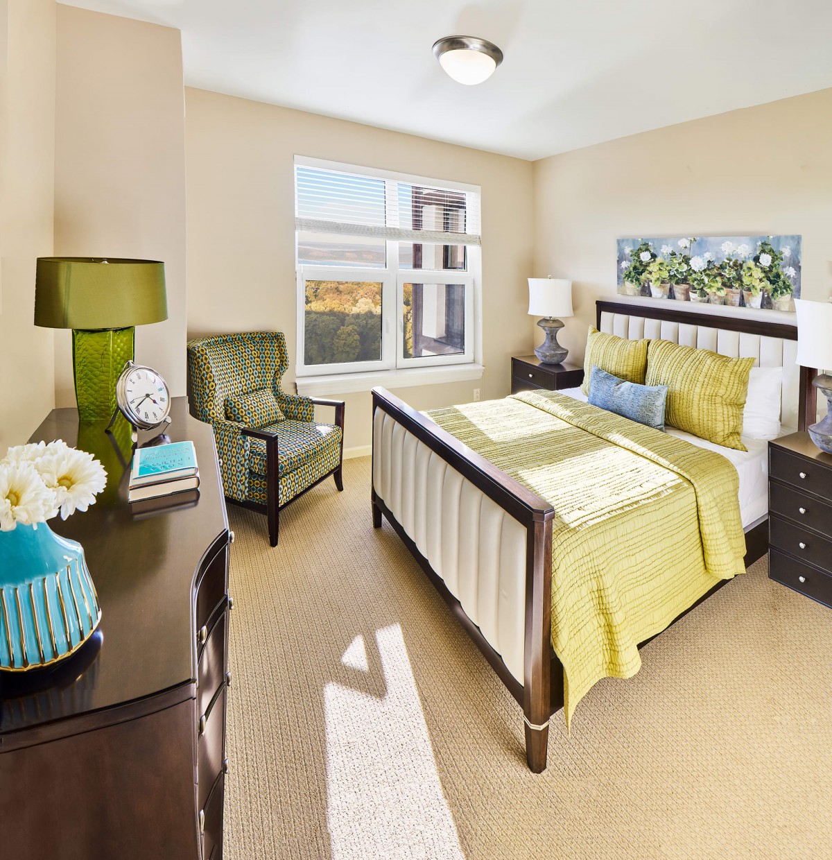 A cozy bedroom with modern decor and natural lighting.