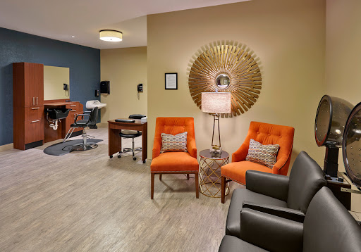 A stylish waiting room featuring modern furniture and decor.