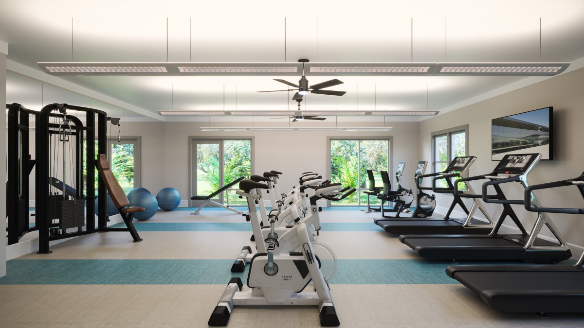 A modern gym with stationary bikes, treadmills, and exercise equipment.