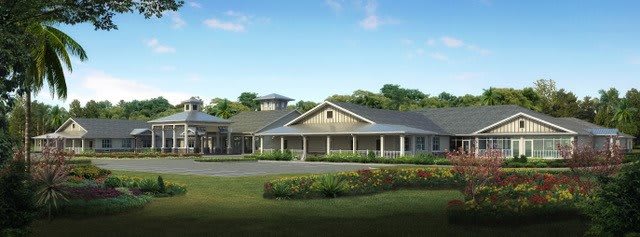 A spacious residential building with a well-maintained garden and clear blue sky.