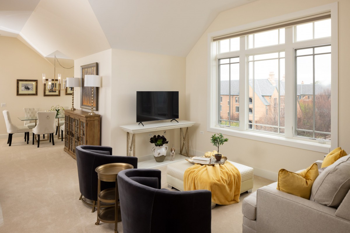 A modern living room with comfortable seating and elegant decor.