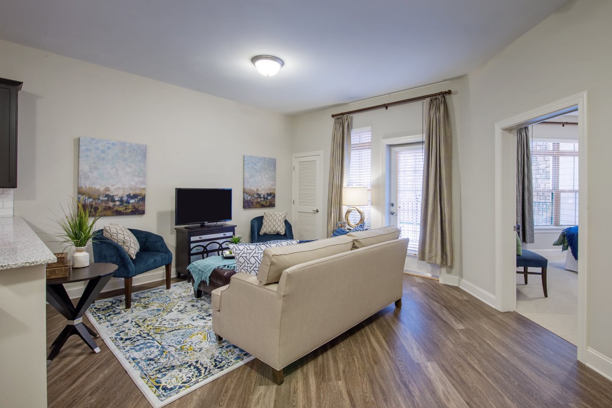 A well-decorated living room with modern furniture and decor.