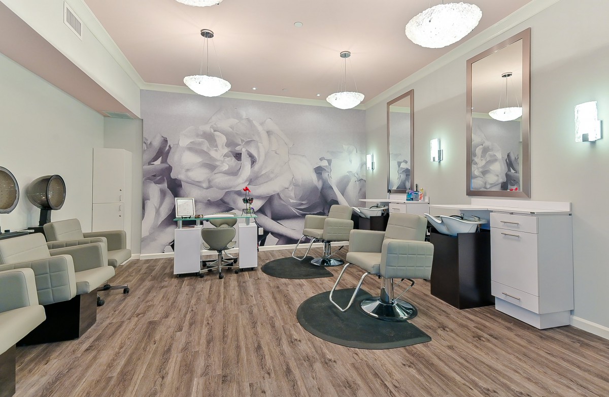 Modern hair salon with stylish decor and comfortable seating.