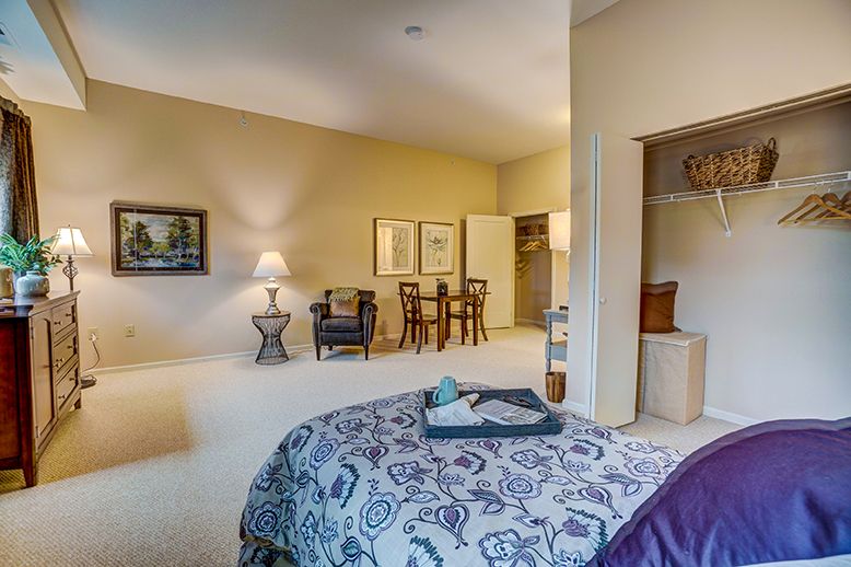 Spacious bedroom with elegant furniture and a cozy ambiance.