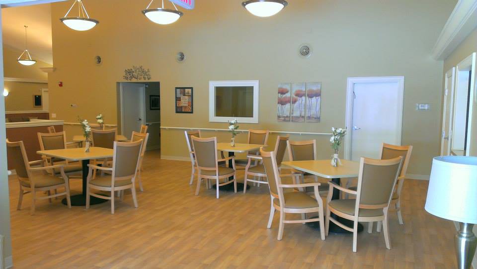A spacious dining area with neatly arranged tables and chairs.