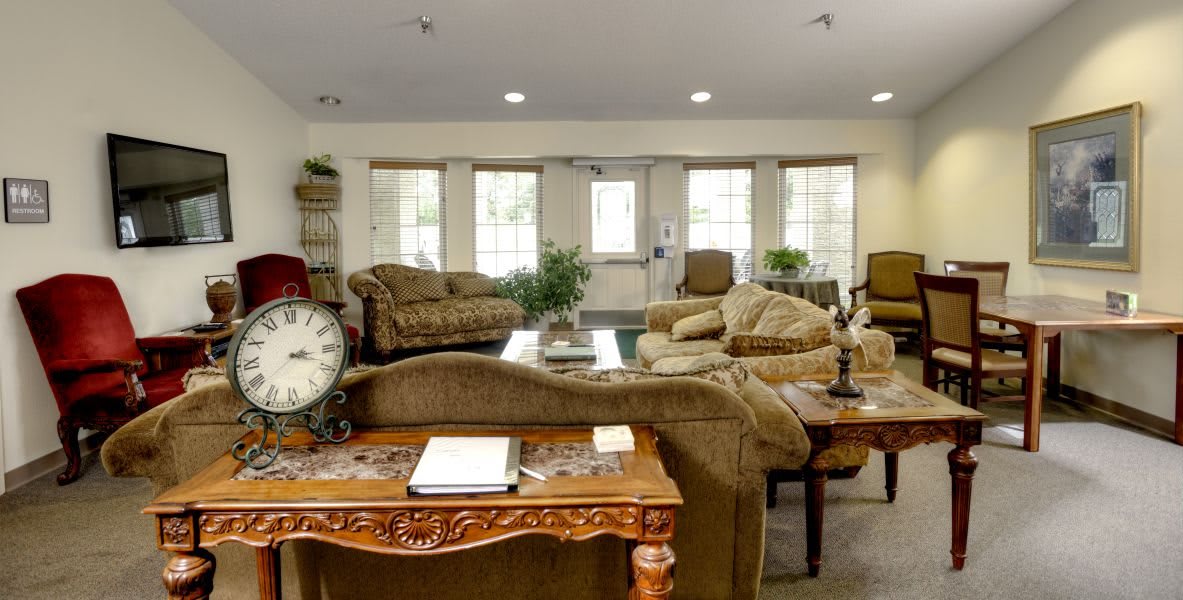 Spacious living room with multiple sofas and elegant decor.