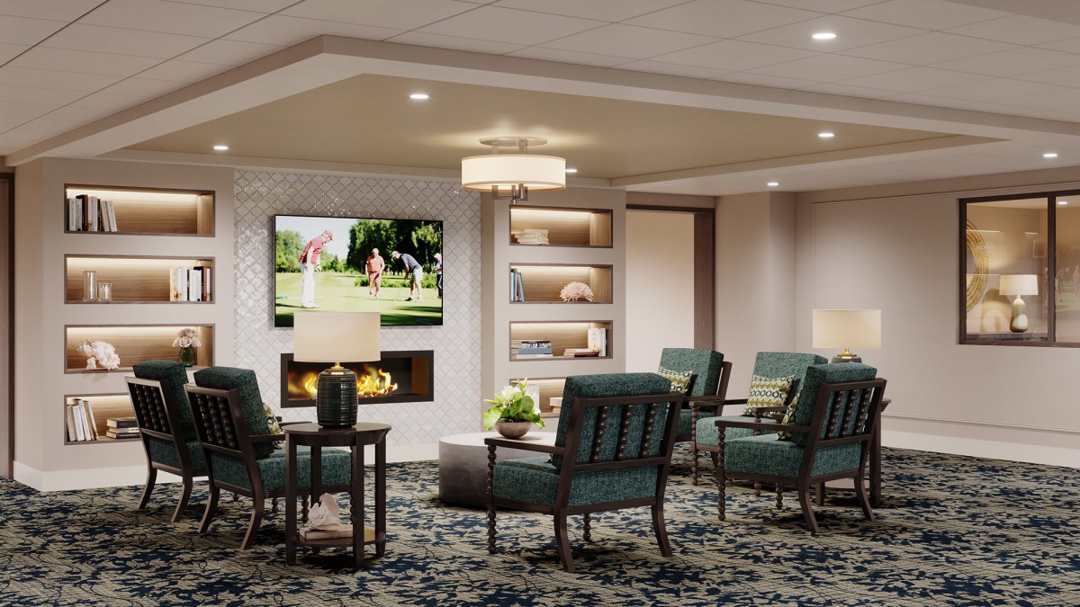 A modern living room featuring a cozy seating area with a television above the fireplace, complemented by elegant lighting and decor.