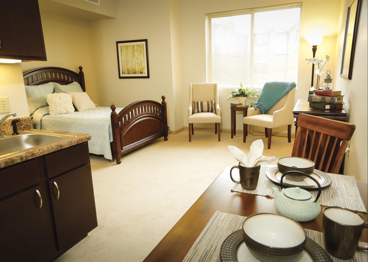 A cozy bedroom with classic furniture and soft natural lighting.