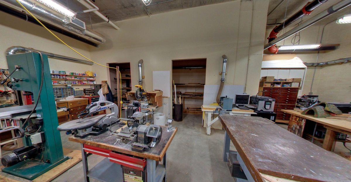 A well-equipped workshop with various tools and machines for industrial use.