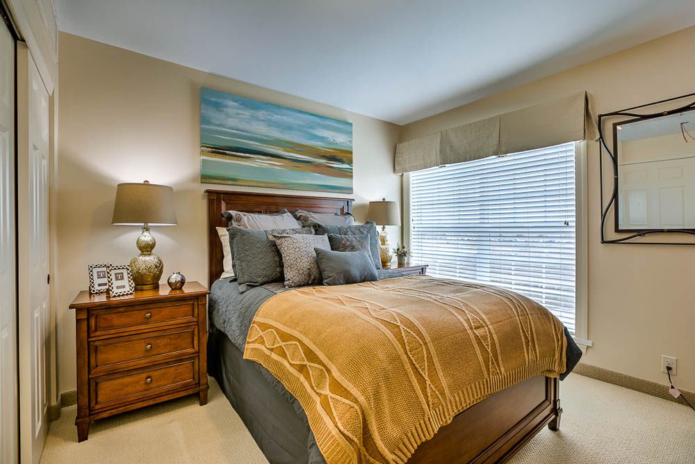 A cozy, modern bedroom with stylish decor and a warm atmosphere.