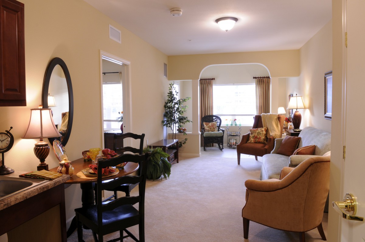 A cozy living room with elegant furniture and natural lighting.