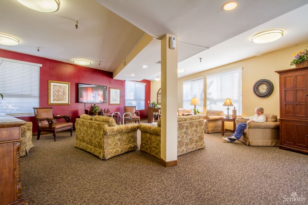 A cozy living room with comfortable seating and ample natural light.