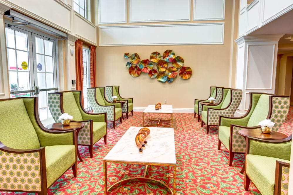 A modern lounge featuring stylish seating and vibrant wall art.