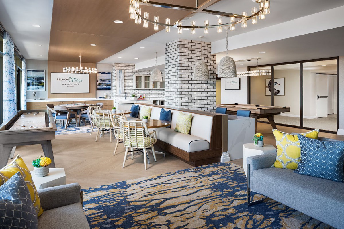 Modern hotel lounge area with comfortable seating and stylish chandeliers.