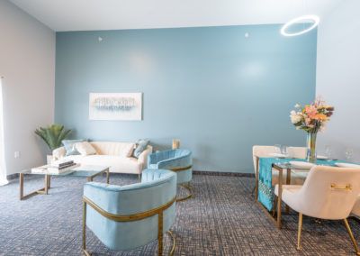 A modern living room with stylish blue accents and contemporary furniture.