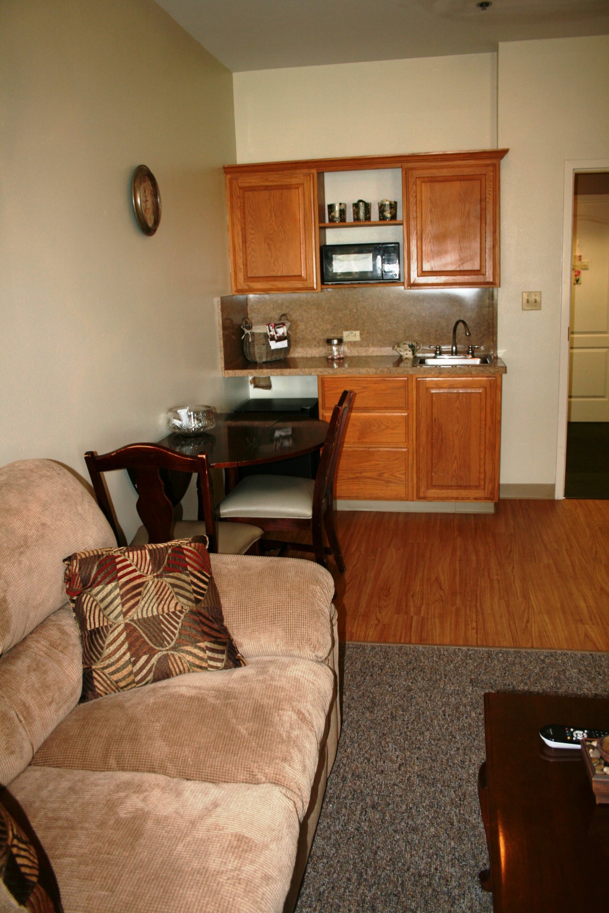 Cozy apartment living area with a small kitchenette and dining space.