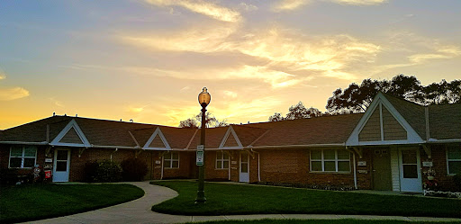 A serene sunset illuminating a charming residential building.