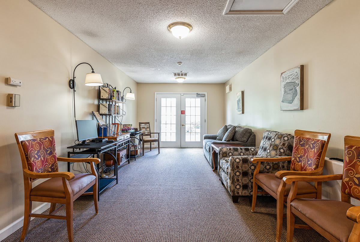 A cozy living room with ample seating and soft lighting.