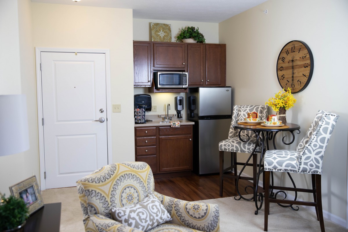 A cozy apartment kitchen and living space with modern decor.