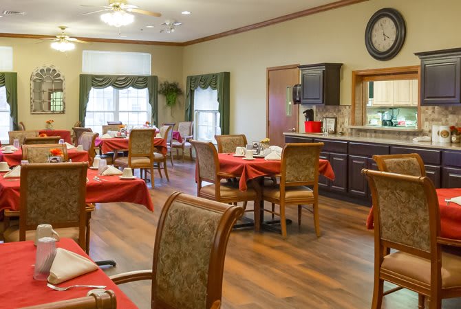 A cozy dining area with decorated tables and comfortable seating.