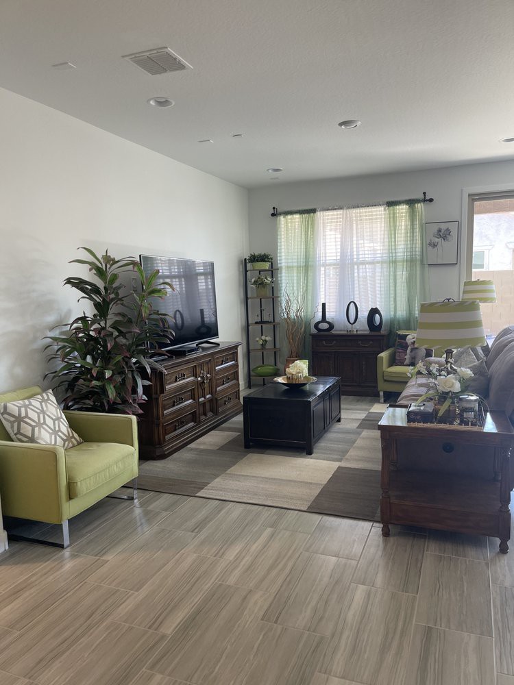 A cozy living room with modern furniture and decor.