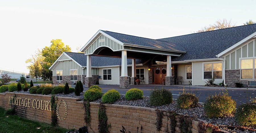 A large building with a welcoming entrance and well-maintained landscaping.