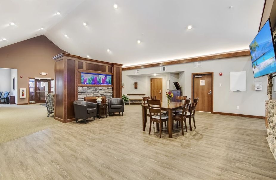 A modern lobby with comfortable seating and elegant wood flooring.