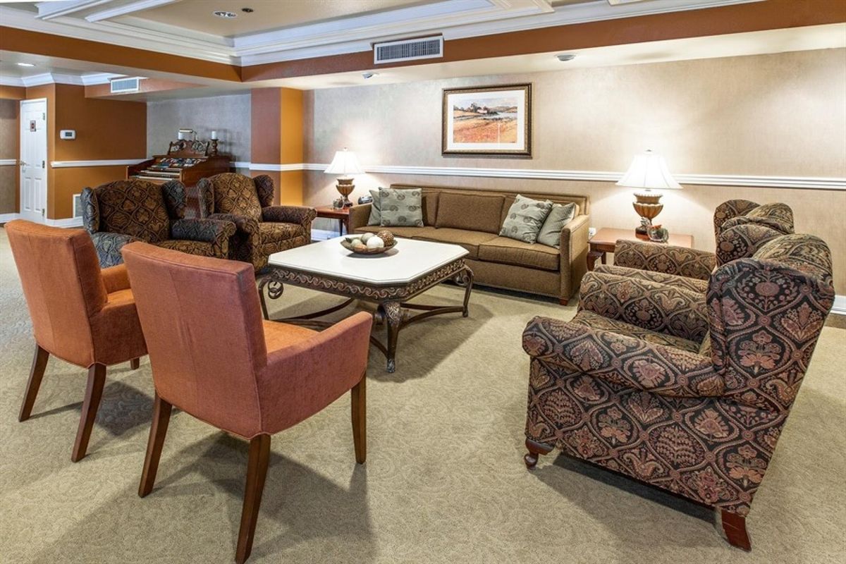 A cozy living room with comfortable seating and warm lighting.